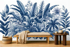 blue and white leaf wallpaper in a living room