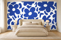 navy blue floral wallpaper in a bedroom